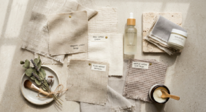 A professional, editorial-style flat lay featuring high-quality organic linen and cotton fabric swat