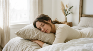 A minimalist, editorial-style photograph of a graceful woman resting her head on a soft, neutral-ton